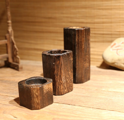 Solid wood candle holder with a natural wood finish from My Store
