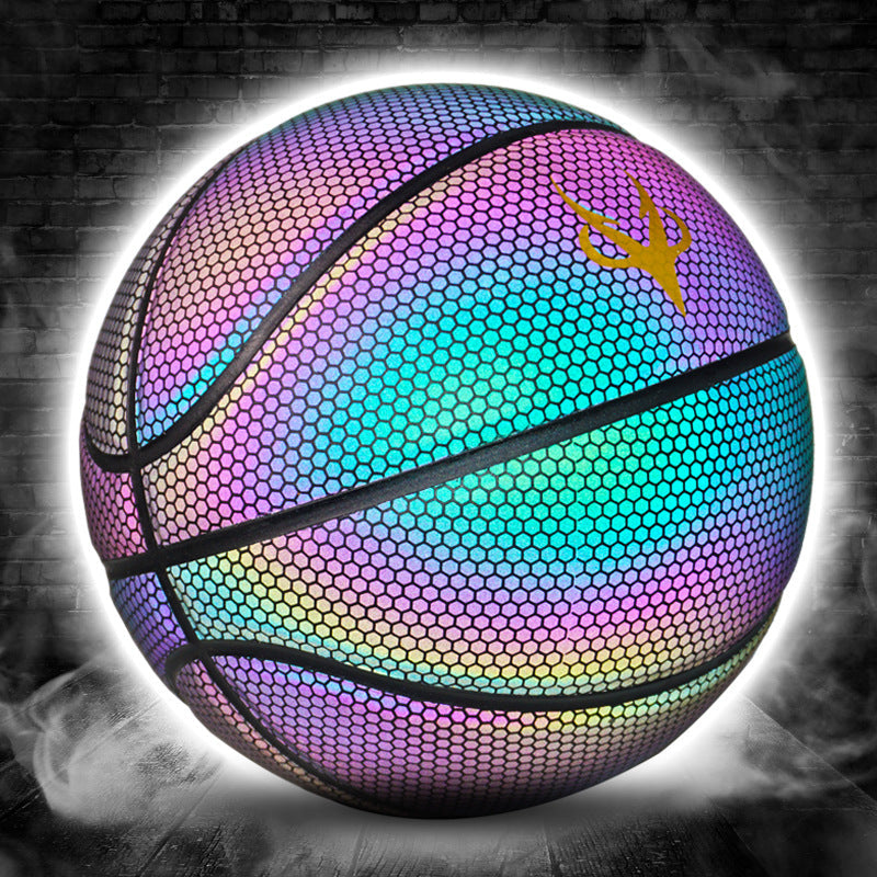 Luminous basketball glowing in the dark, orange textured ball with bright LED-style panels