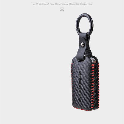 Car leather key case in black with secure snap closure and metal key ring