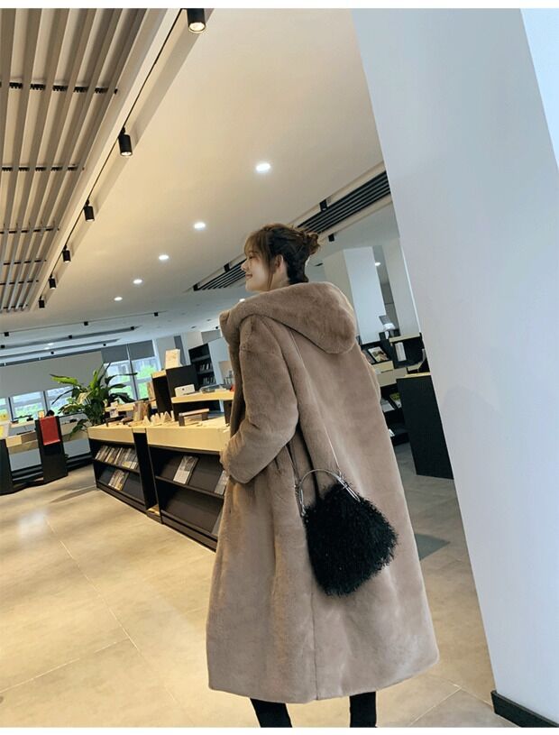 Faux fur mink women’s plush coat in soft, luxurious textured fabricablytyped