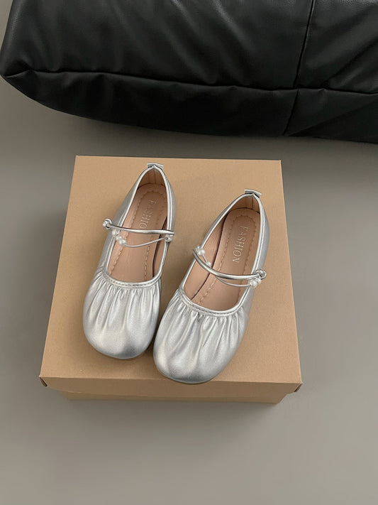 Silver Mary Jane loafers with shallow vamp, rounded toes, and buckle straps for women