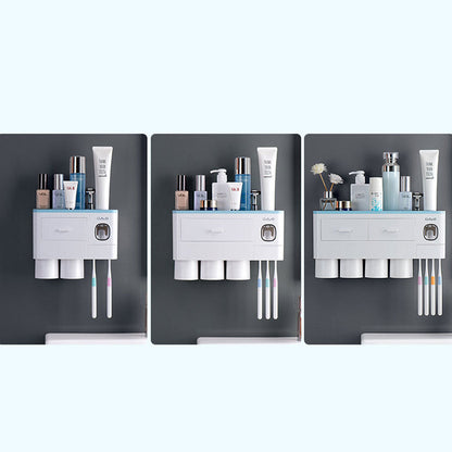 Hanging magnetic toothbrush holder with single drawer, toothpaste squeezer, and non-marking adhesive rackancy