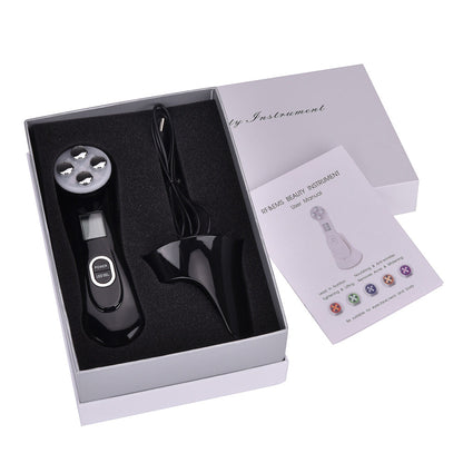 Multifunctional skin rejuvenation care instrument in sleek design recharging on a white background