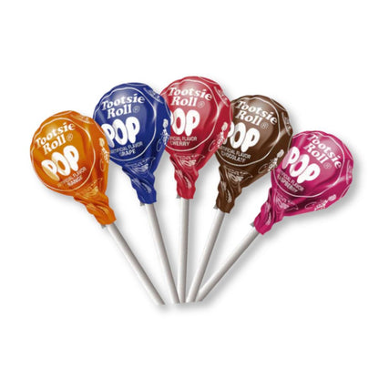 Assorted flavored Tootsie Roll Pops lollipops in a bulk Candy In Bulk bag, featuring colorful round candies on sticks.