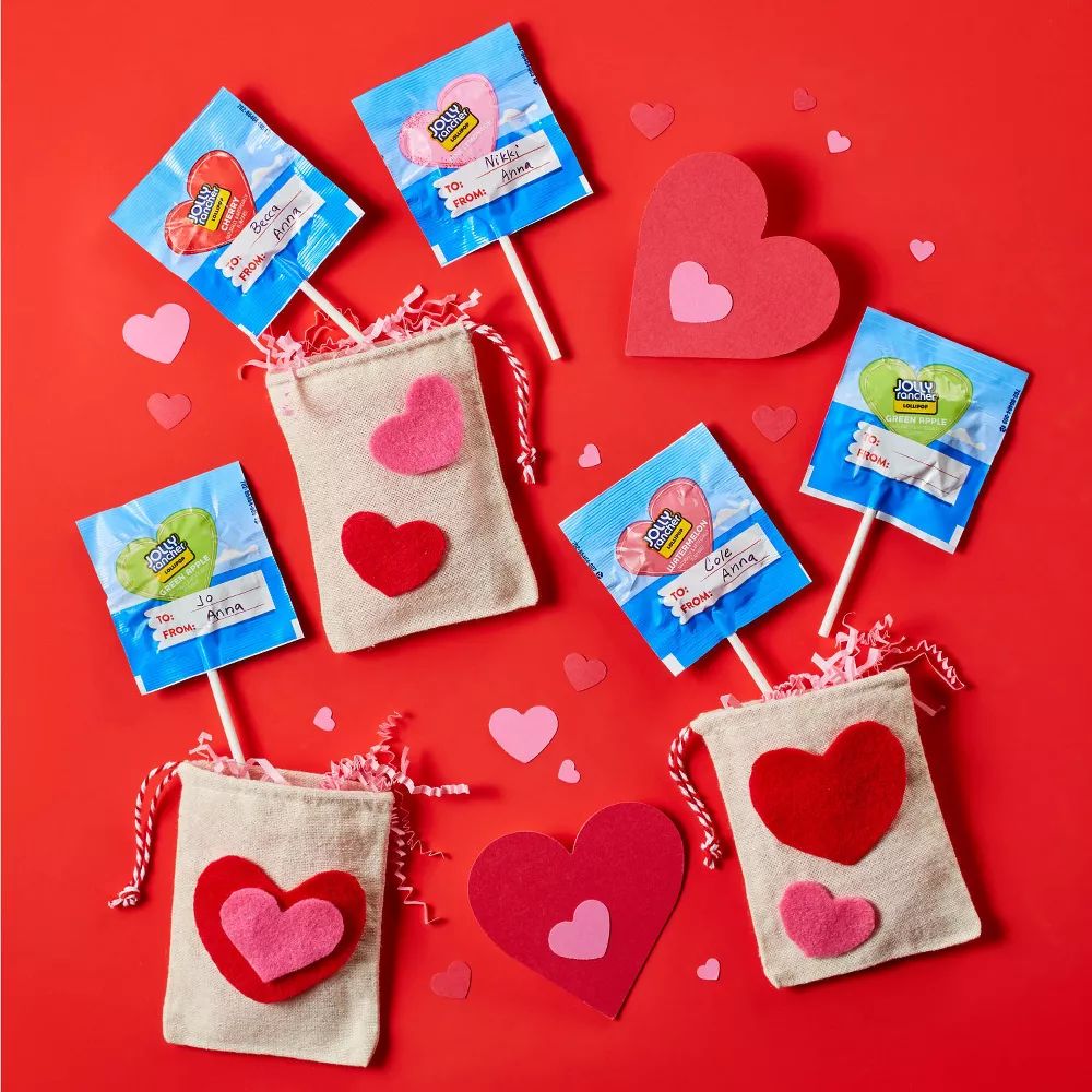 Assorted Jolly Rancher Hearts shaped lollipops from Candy In Bulk in a bulk value bag, perfect for Valentine's Day.