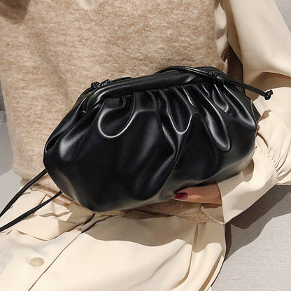 Black and white PU leather clutch handbag with shoulder strap, stylish women's hand and crossbody bag by Feelontop Jewellery.