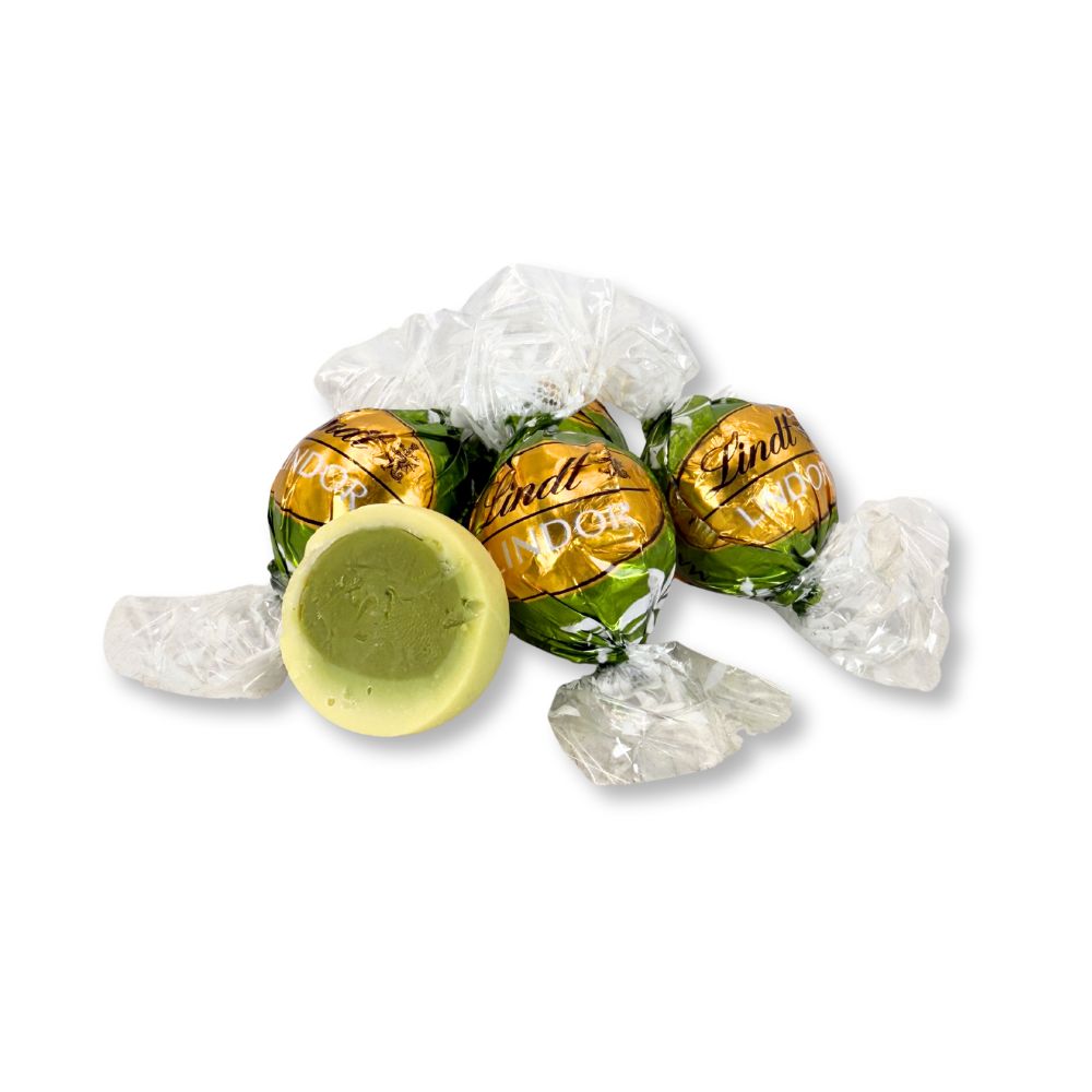 Lindt LINDOR Matcha White Chocolate Truffles in bulk, creamy green tea-flavored chocolate candies from Candy In Bulk.