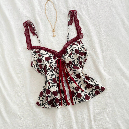 Lace-trimmed camisole with floral bow detail, fashionable versatile women’s top
