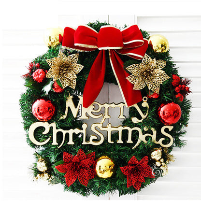 Christmas wreath decoration with festive greenery and ornaments displayed on a door