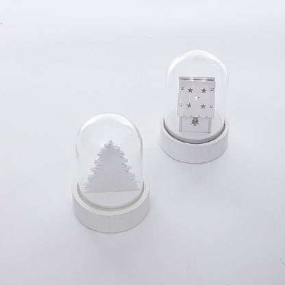 Luminous wooden Christmas house ornament decoration with festive details and warm glowing windows