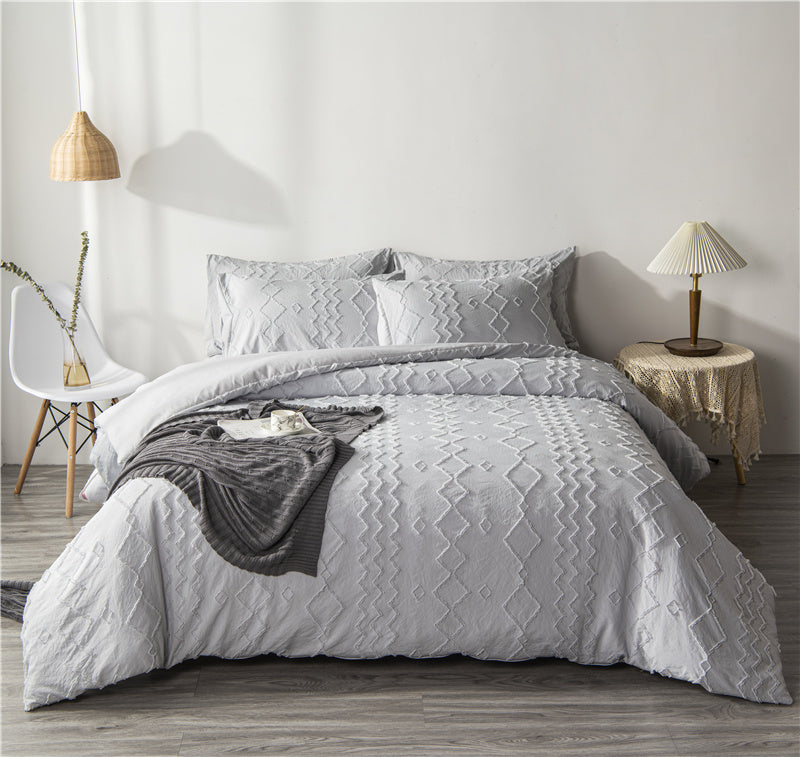 Bohemian quilt cover set with intricate craft pattern, available in three or four-piece bedding sets