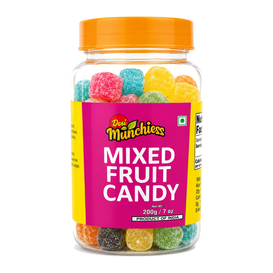 Colorful mixed fruit candies in a clear bowl from Desimunchiess, showcasing vibrant, assorted fruit-shaped snack candies.