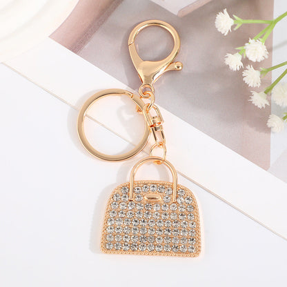 Minimalist diamond-studded handbag charm keychain in a creative design