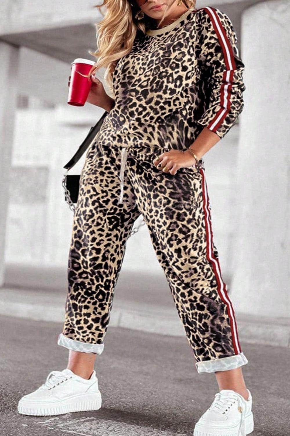 Plus size leopard print round neck top and matching pants set for women, stylish and comfortable fashion by Trendsi.