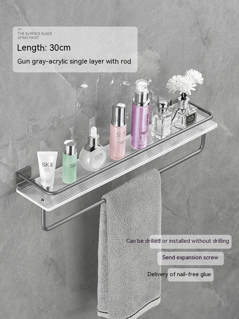 Acrylic bathroom storage rack for neatly organizing folded towels; clear wall-mounted design
