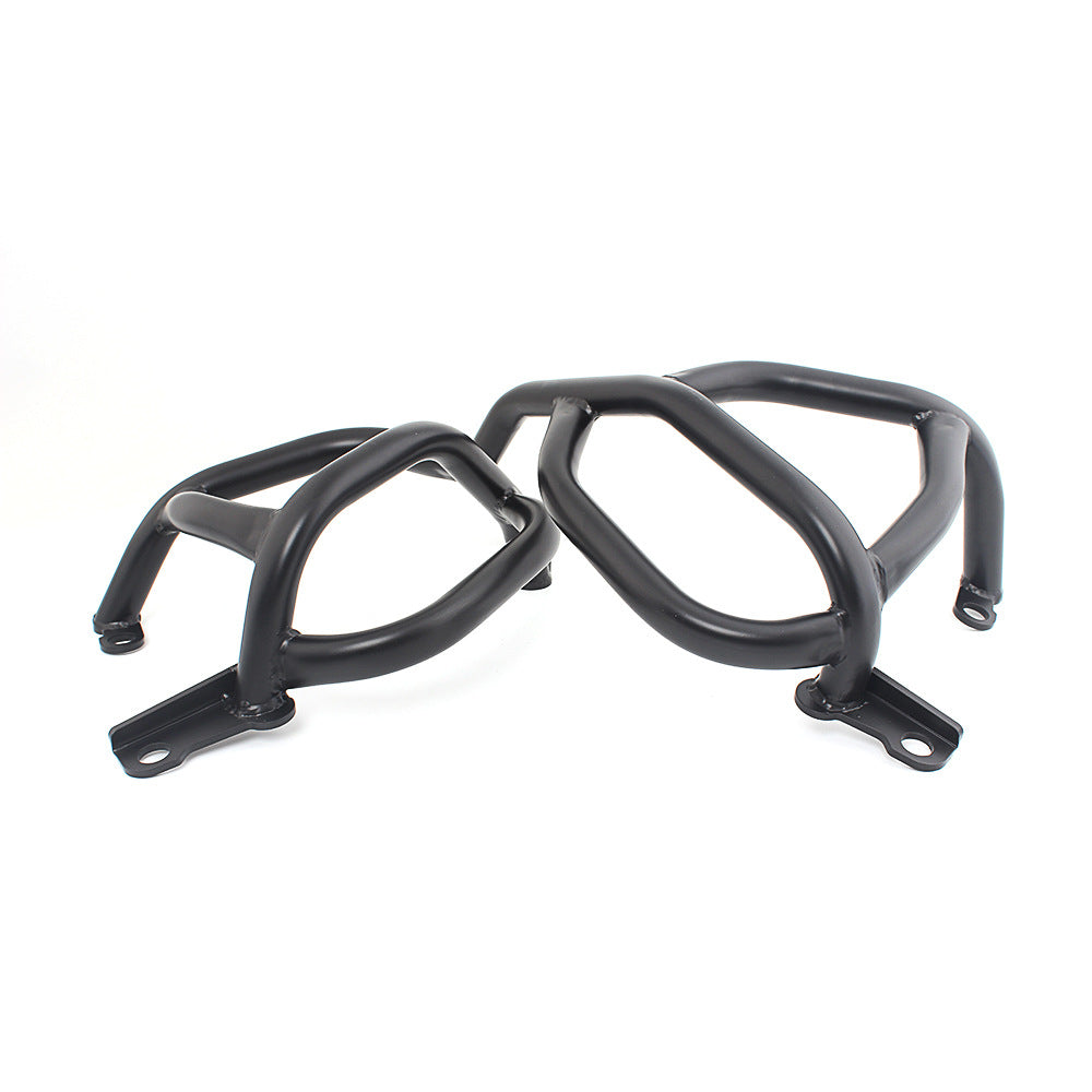 Modified motorcycle engine guard bar mounted on a motorcycle frame, black protective crash bar close-up