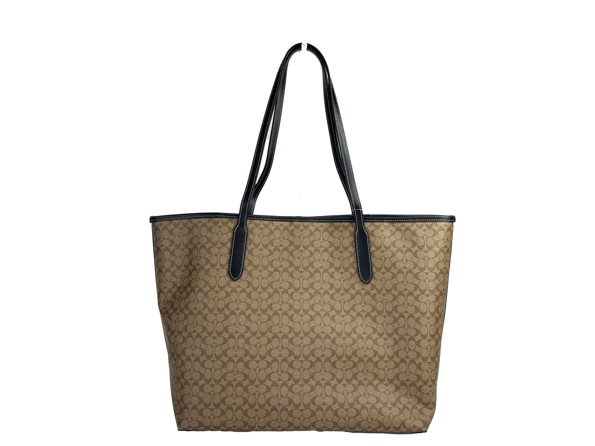 Coach Khaki Signature City Tote Bag with structured design and shoulder straps, stylish and spacious for everyday use.