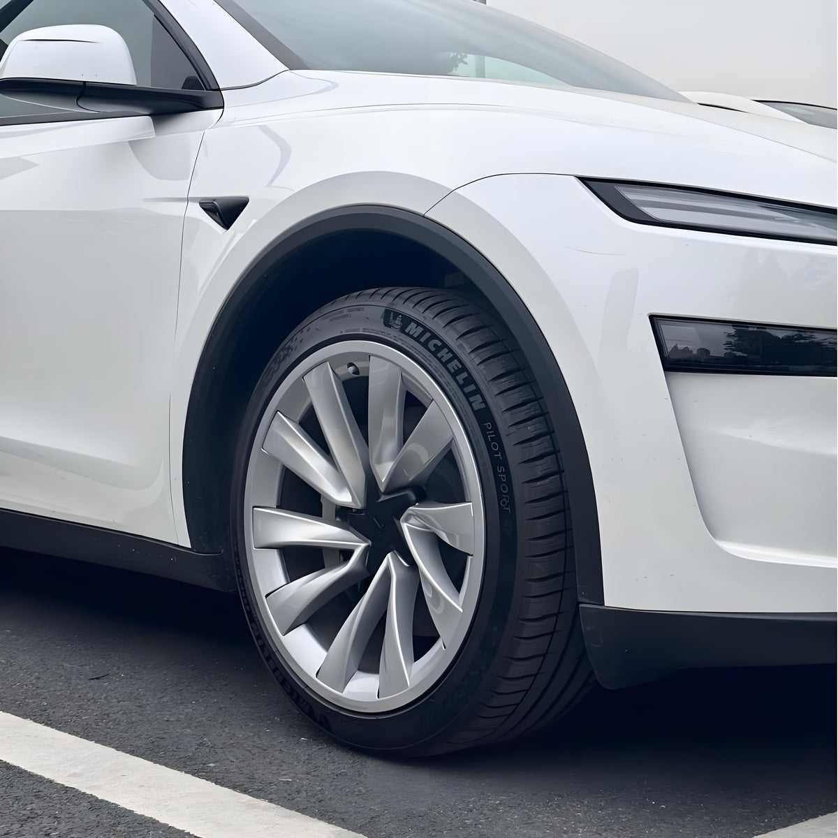 Set of four 20-inch wheel rim protectors for Tesla Model Y Juniper, designed to safeguard wheel covers from damage.
