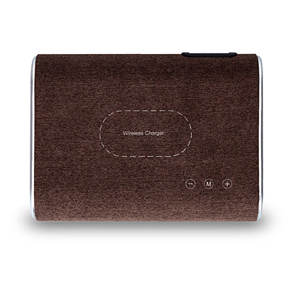 Wireless charger speaker with integrated charging pad and compact modern design