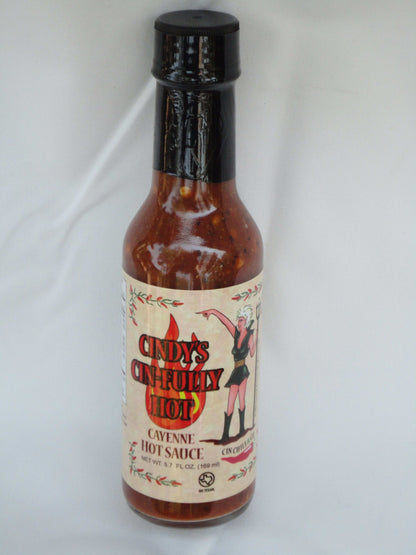 Cindy's Cin-fully Hot Cayenne Hot Sauce bottle with bright label, showcasing vibrant red cayenne peppers and spicy flavor details.