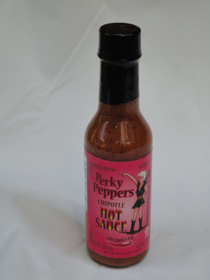 Cinderosa Ranch Perky Peppers Chipotle Hot Sauce bottle with label, showcasing vibrant orange and red colors on the hot sauce packaging.