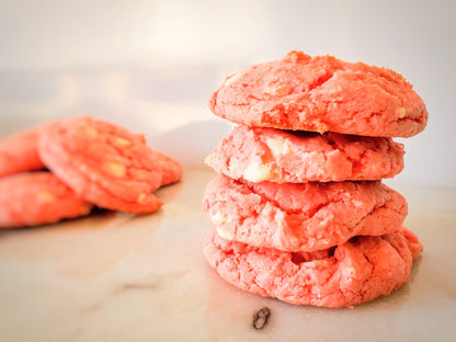 Assorted strawberry cookies from Let's Get Baked Artisan Desserts arranged on a plate, showcasing fresh strawberry fillings and cookie textures.