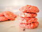 Assorted strawberry cookies from Let's Get Baked Artisan Desserts arranged on a plate, showcasing fresh strawberry fillings and cookie textures.