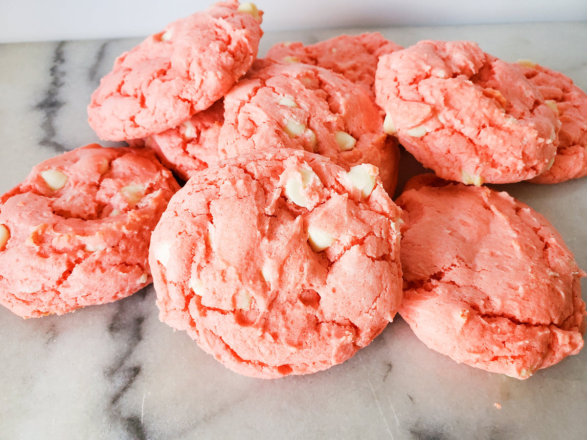 Assorted strawberry cookies from Let's Get Baked Artisan Desserts, featuring fresh strawberry pieces and cookie textures.