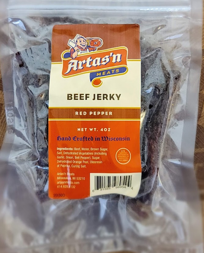 Spicy red pepper beef jerky from Artas'n Meats, showing thick, seasoned slices of beef jerky with red pepper flakes.