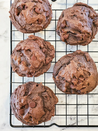 Assorted Death by Chocolate cookies from Let's Get Baked Artisan Desserts on a plate, featuring rich chocolate and cookie textures.
