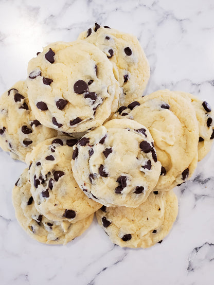 Freshly baked chocolate chip cookies dozen by Let's Get Baked Artisan Desserts, showcasing golden cookies with chocolate chips.