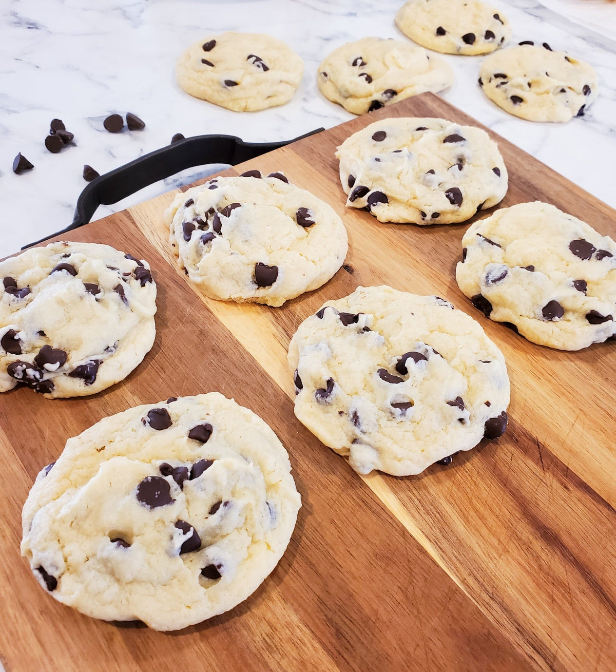 Assorted chocolate chip cookies from Let's Get Baked Artisan Desserts, freshly baked dozen cookies with gooey chocolate chips.