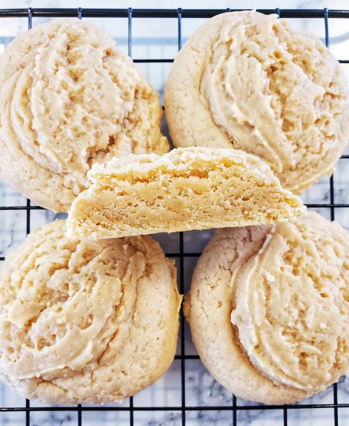 Assorted peanut butter cookies from Let's Get Baked Artisan Desserts, showing a dozen freshly baked cookies on a plate.