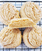 Assorted peanut butter cookies from Let's Get Baked Artisan Desserts, showing a dozen freshly baked cookies on a plate.