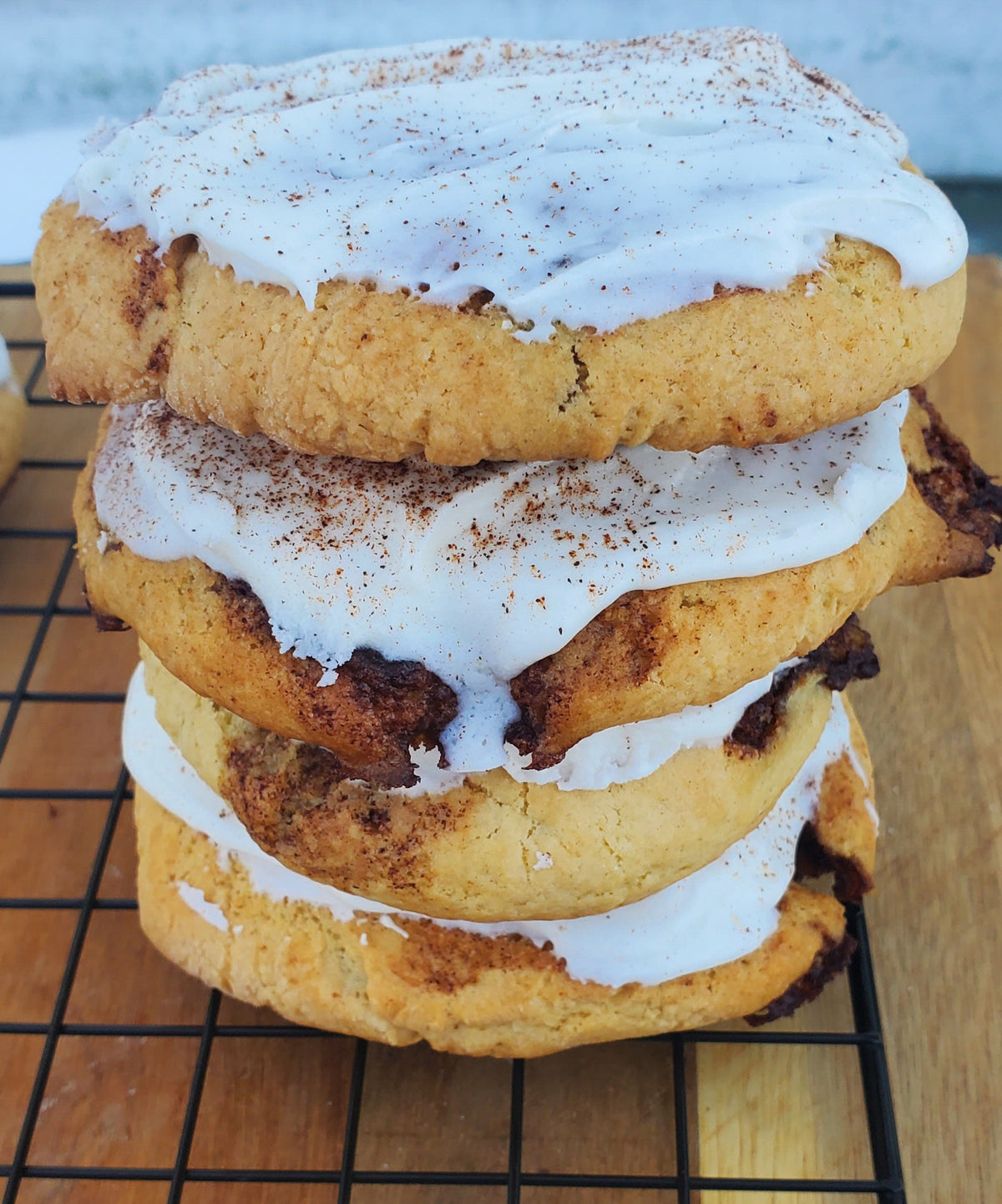 Let's Get Baked Artisan Desserts cinnamon roll cookies with swirled cinnamon filling on a plate.