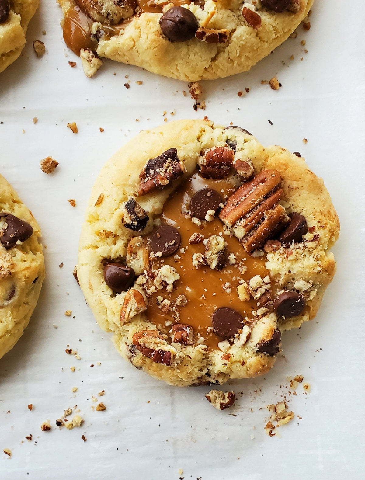 Chocolate turtle cookies from Let's Get Baked Artisan Desserts, featuring a crispy cookie shell topped with caramel and chocolate.