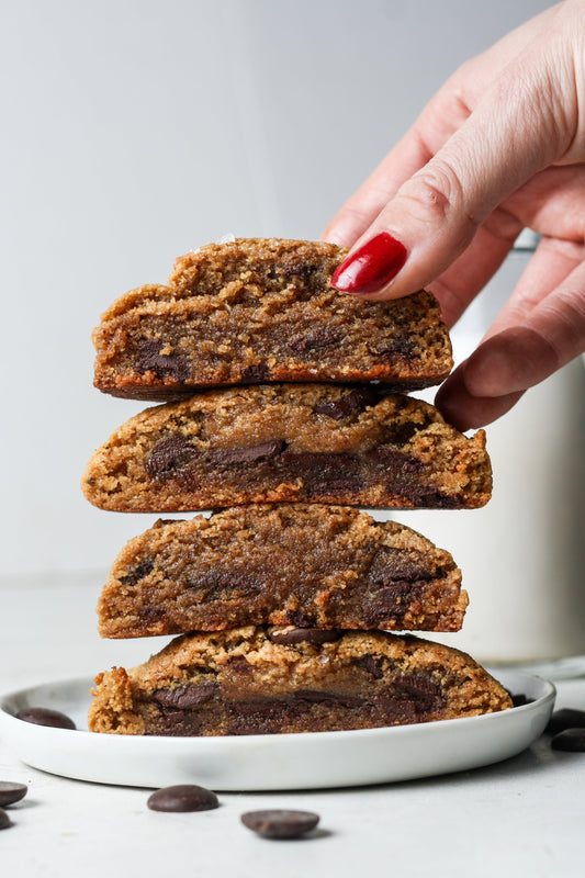 Close-up of freshly baked Chocolate Chip Cookies by Sweet Addison's, showing golden-brown cookies with chocolate chips on a plate.