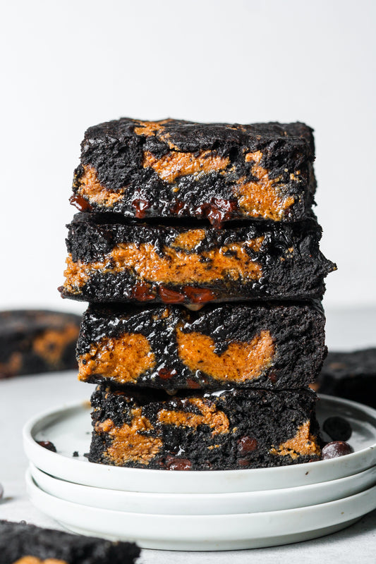 Chocolate brownies with peanut butter swirls from Sweet Addison's, showcasing a close-up of rich, moist peanut butter brownies.