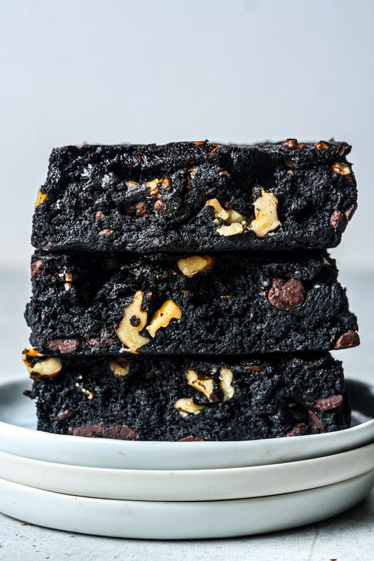 Chocolate walnut protein brownies from Sweet Addison's, close-up of sliced brownies with walnuts and rich chocolate texture.
