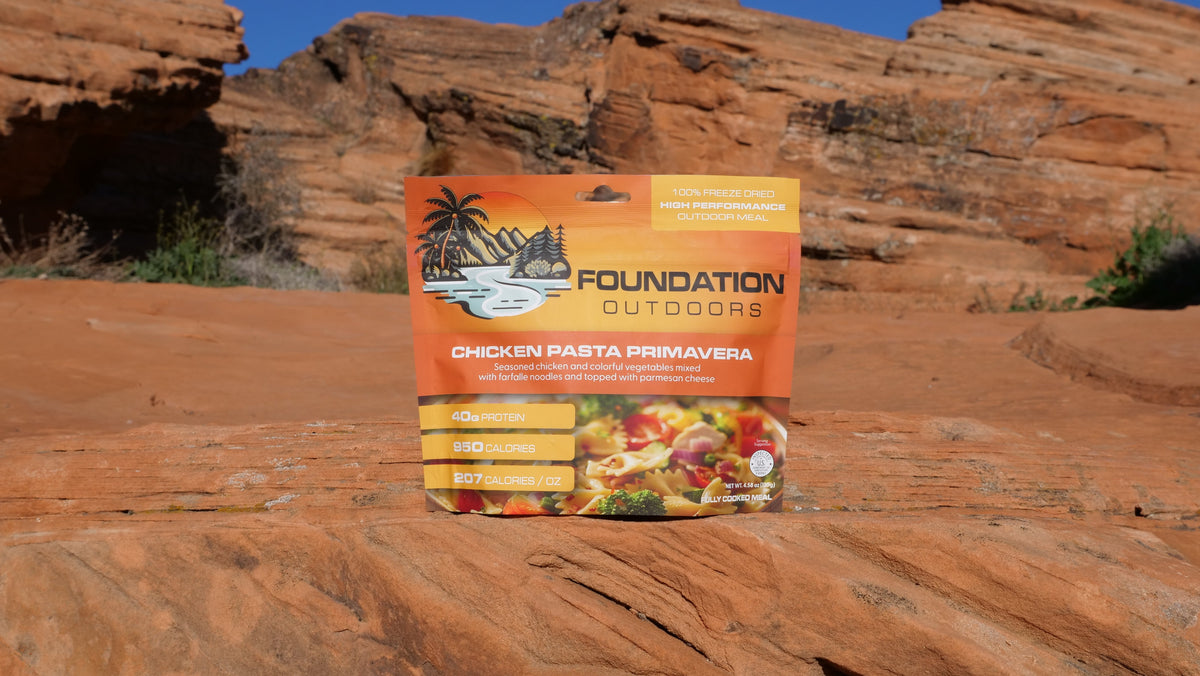 Chicken Pasta Primavera meal from FOUNDATION Outdoors, featuring pasta with chicken, fresh vegetables, and vibrant spring flavors.