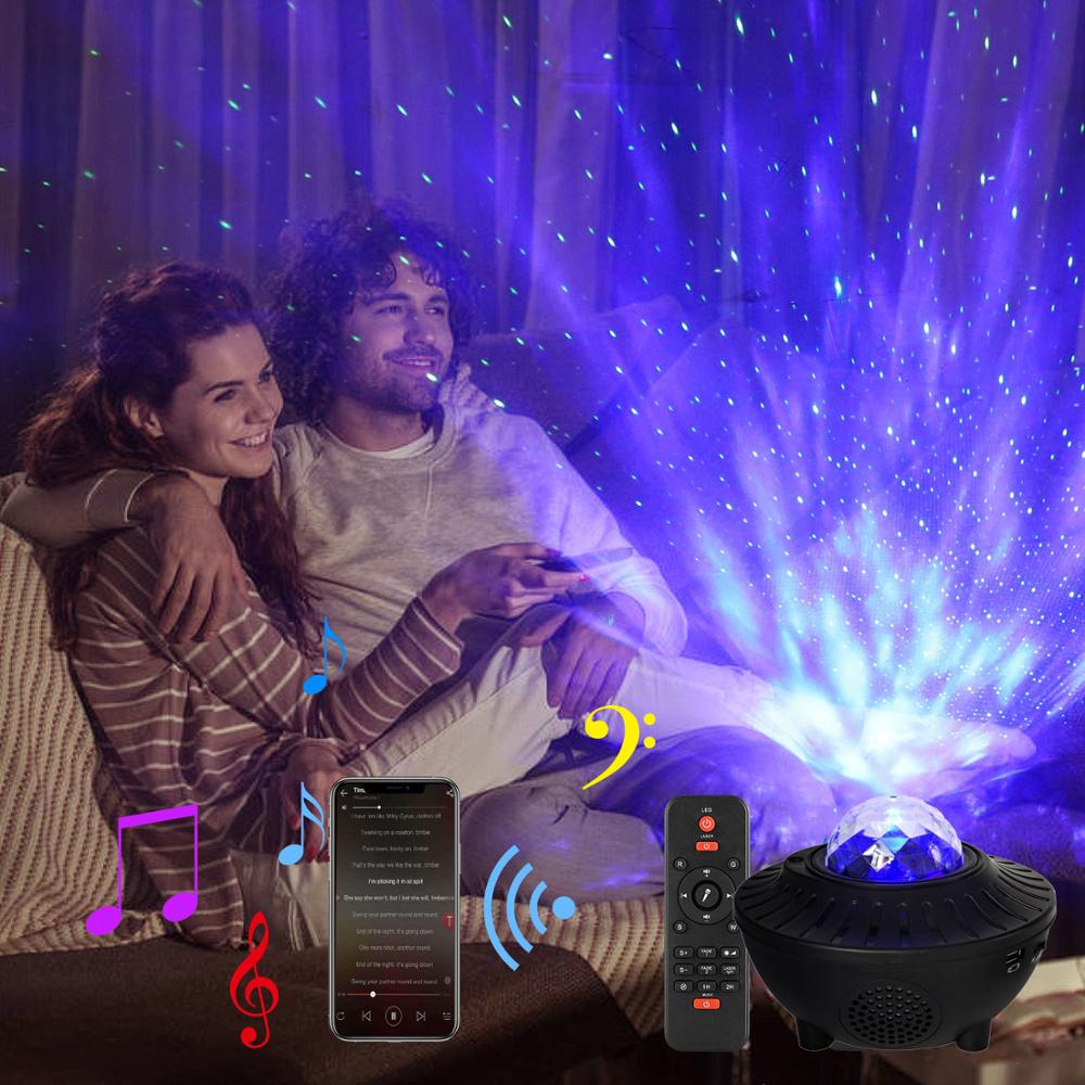 LED Bluetooth music projector light displaying colorful star patterns on a dark background