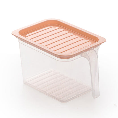 Household refrigerator crisper drawer viewed from above, with clear plastic storage compartment
