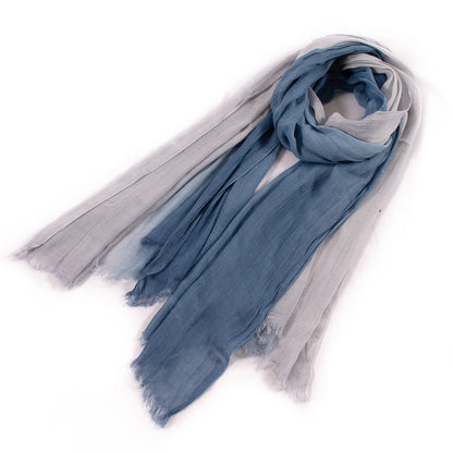 Large soft warm cotton tassel scarf laid flat, showcasing its cozy woven texture and fringed edges