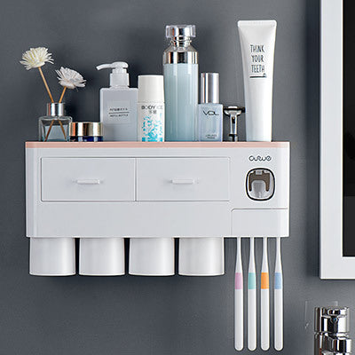 Non-marking hanging magnetic toothbrush holder with single drawer, toothpaste squeezer, and toiletry storage rack