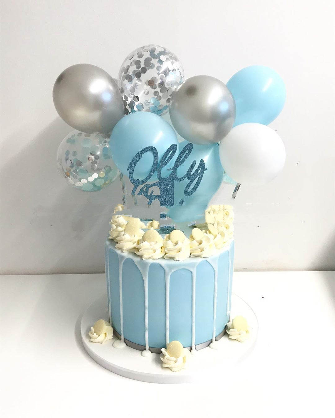 Red 5-inch sequined balloon cake decoration on a small cake topper stick