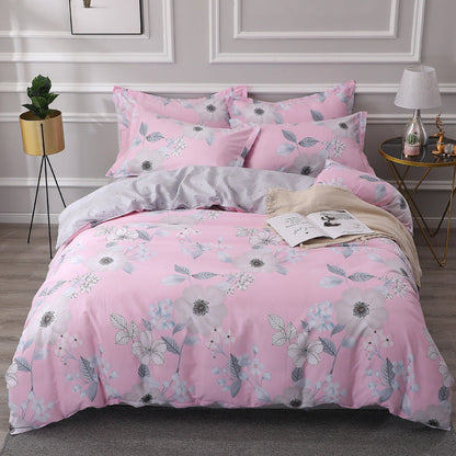 Four-piece cotton bedding set in soft home textile fabric, arranged to show the complete set
