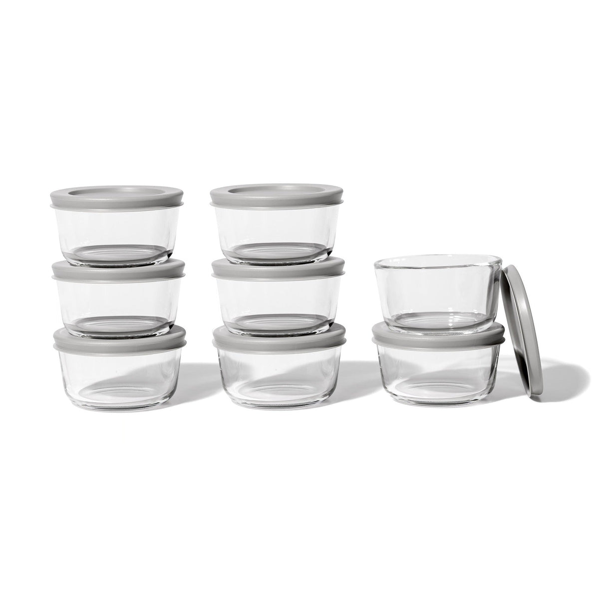 Set of 16 Dura Living round glass storage containers with grey lids, 7 oz capacity, ideal for kitchen organization and food storage.