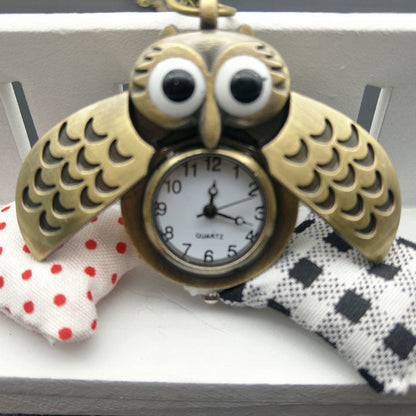 Owl pocket watch with detailed owl design on the case