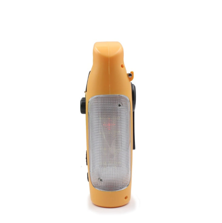 Hand-cranked radio emergency light with compact design and integrated flashlight controls