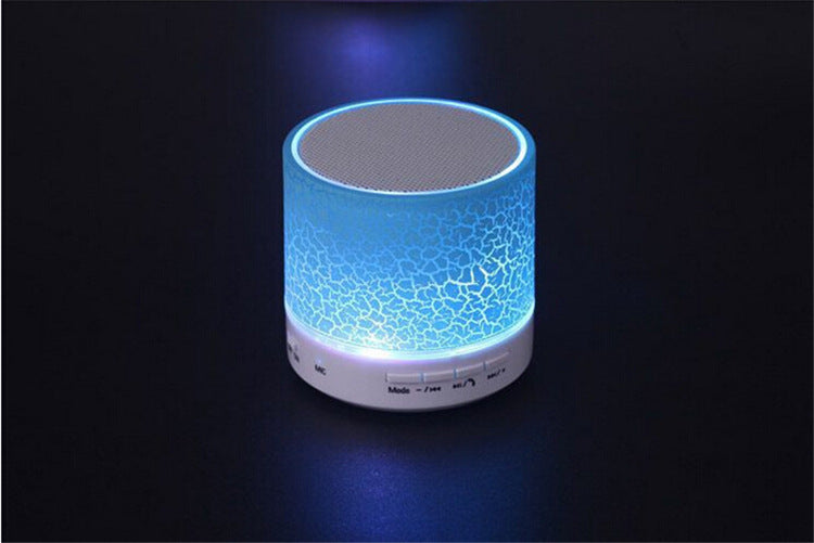 Mini wireless Bluetooth speaker, compact black portable design shown from the front